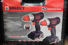 Three boxes of as new Sparky professional heavy duty drill sets.