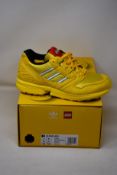 A pair of as new Adidas ZX 8000 Lego trainers (UK 6.5).