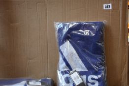 Approximately thirty Adidas sports towels in blue and black.