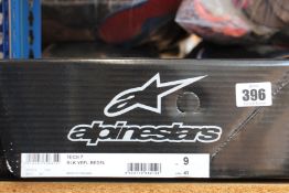 A pair of boxed as new Alpinestars Tech 7 Motocross boots in black, fluorescent red and yellow (US
