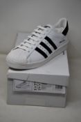 A pair of as new Adidas Prada Superstar sneakers (UK 10).