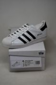 A pair of as new Adidas Prada Superstar sneakers (UK 8.5).