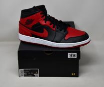 A pair of as new Nike Air Jordan 1 Mid (UK 14).