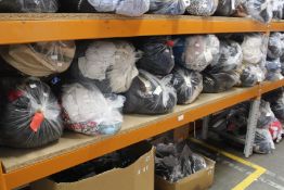 Twelve bags of pre-owned clothing and related items.
