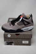 A pair of as new Nike Air Jordan 4 Retro with authentication tag (UK 7.5).