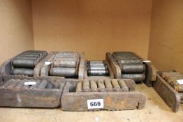 Seven pre-owned machine caterpillar skates.