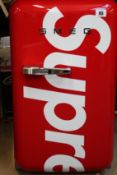 A pre-owned Supreme Smeg mini fridge (Some visible damage, viewing advised).