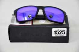 A pair of as new Oakley Holbrook sunglasses.