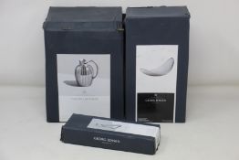 A boxed as new Georg Jensen Bernadotte Collection 1.6L pitcher, an as new Georg Jensen Bloom