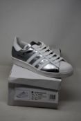 A pair of as new Adidas Prada Superstar sneakers (UK 9).