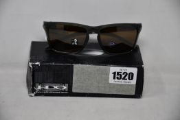 A pair of as new Oakley Sylas sunglasses.