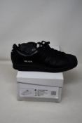 A pair of as new Adidas Prada Superstar sneakers (UK 10.5).