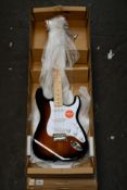 A boxed as new Fender Squier Affinity Series Stratocaster in Sunburst.