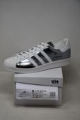 A pair of as new Adidas Prada Superstar sneakers (UK 12).