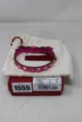 An as new Valentino leather studded bracelet in pink.