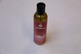 A large quantity of DONA Kissable Massage Oil - Vanilla and Buttercream (Aphrodisiac and pheromone