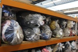 Twelve bags of pre-owned clothing and related items.