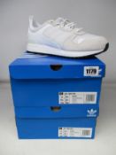 Two pairs of as new Adidas ZX 700 HD trainers (UK 10.5).