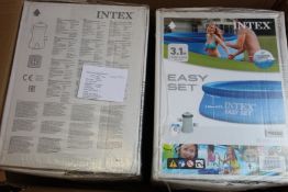 Two boxed as new Intex Easy Set 3.1m swimming pools.