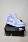 A pair of as new Nike Air Jordan 1 Mid (UK 9).