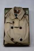 An as new children's Burberry Mayfair trench coat (6 Years - RRP £770).