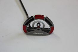 An Odyssey Red Ball Putter.