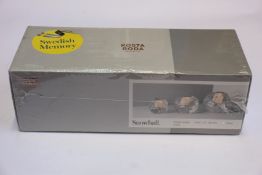 A boxed as new Kosta Boda Snowball Votive Holder Set (3 pcs H 60/70/90mm).