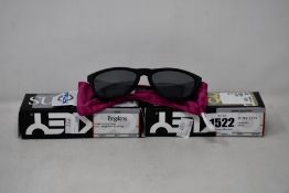 Two pairs of as new Oakley Frogskins sunglasses.