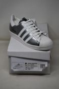 A pair of as new Adidas Prada Superstar sneakers (UK 9).