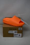 A pair of as new Adidas Yeezy Slides with authentication tag (UK 10).