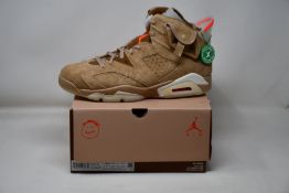 A pair of as new Nike Jordan 6 Retro Travis Scott with authentication tag (UK 10.5).