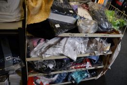 A quantity of assorted as new clothing and related items.