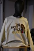 An as new The North Face Gucci sweater with authentication tag (XL).