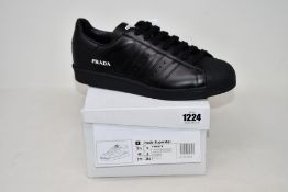 A pair of as new Adidas Prada Superstar sneakers (UK 9).