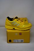 A pair of as new Adidas ZX 8000 Lego trainers (UK 6.5).