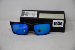 A pair of as new Oakley Holbrook sunglasses.