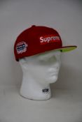 An as new Supreme No Comp Box Logo New Era baseball cap in red.