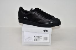 A pair of as new Adidas Prada Superstar sneakers (UK 12).