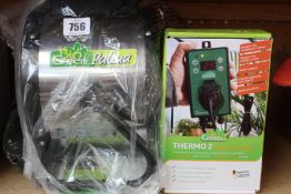 A BioGreen Palma greenhouse heater with a Thermo 2 Digital thermostat.