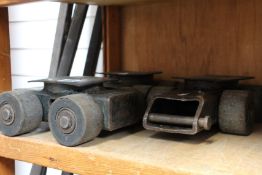 Three pre-owned machine skates and four bars.