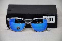 A pair of as new Oakley Trillbe X sunglasses.