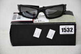 A pair of as new Oakley (4+1)2 sunglasses.