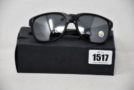 A pair of as new Oakley Anorak sunglasses.