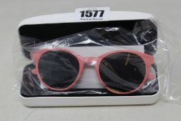 A pair of as new Calvin Klein sunglasses.