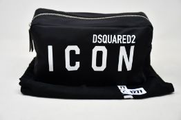 An as new Dsquared2 Icon logo-print messenger bag (RRP £270).