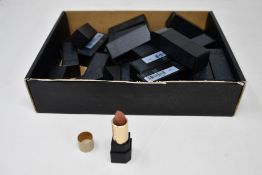 Twenty seven Suqqu sheer matte lipsticks in various shades.