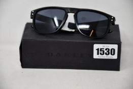 A pair of as new Oakley Holbrook sunglasses.
