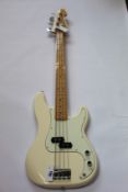 A Fender Precision Bass in white.