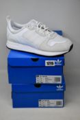 Two pairs of as new Adidas ZX 700 HD trainers (UK 9).