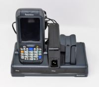 A pre-owned Intermec CN70 Barcode Scanner (M/N: 1000CP01U) with Intermec 852-920-001 Charging